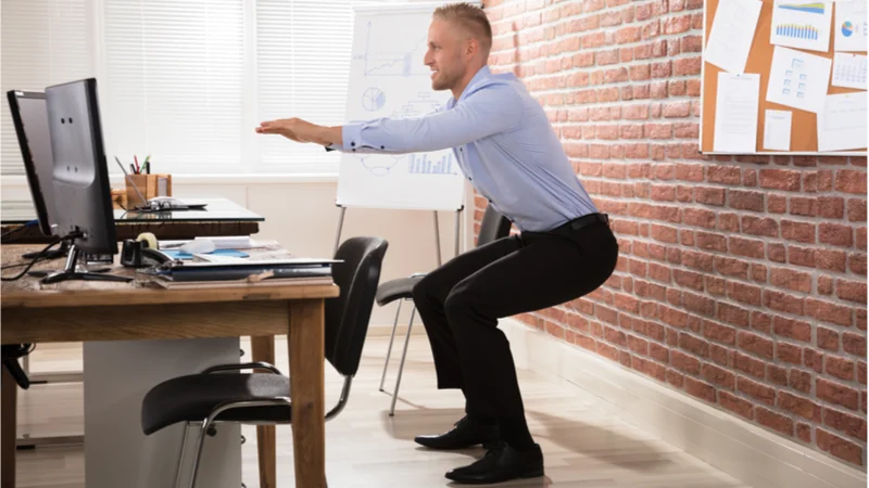 Squatting at desk