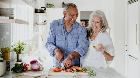 Elderly couple eating food