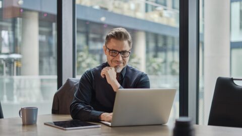 Older man using laptop